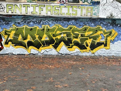 Yellow and Green and Light Blue Stylewriting by Muser. This Graffiti is located in Leipzig, Germany and was created in 2023. This Graffiti can be described as Stylewriting and Wall of Fame.