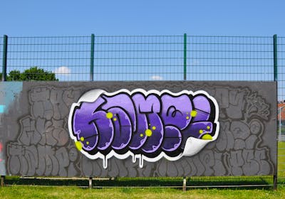 Violet and White and Grey Stylewriting by HAMPI. This Graffiti is located in MÜNSTER, Germany and was created in 2023. This Graffiti can be described as Stylewriting, Wall of Fame and Throw Up.