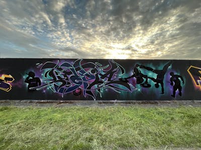 Cyan and Violet and Black Stylewriting by Utopia. This Graffiti is located in Germany and was created in 2023. This Graffiti can be described as Stylewriting, Characters and Atmosphere.
