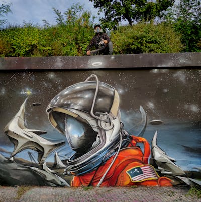 Grey and Orange Characters by Caer8th. This Graffiti is located in Prague, Czech Republic and was created in 2022. This Graffiti can be described as Characters, Stylewriting and Wall of Fame.