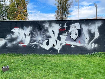 Grey and Black and Chrome Stylewriting by Akai82 and SM crew. This Graffiti is located in Prague, Czech Republic and was created in 2022. This Graffiti can be described as Stylewriting, Characters and Wall of Fame.