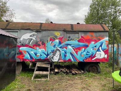 Light Blue and Colorful Stylewriting by Tesla. This Graffiti is located in Saint-Petersburg, Russian Federation and was created in 2021. This Graffiti can be described as Stylewriting, Characters and Cars.
