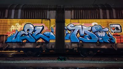 Light Blue Stylewriting by DCK, Elmo and ALL CAPS COLLECTIVE. This Graffiti is located in Hungary and was created in 2020. This Graffiti can be described as Stylewriting, Trains, Freights and Characters.