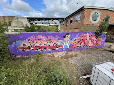 Coralle and Violet Stylewriting by Picks and Spast. This Graffiti is located in Hettstedt, Germany and was created in 2021. This Graffiti can be described as Stylewriting and Characters.