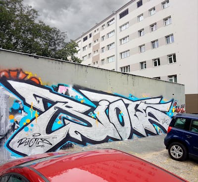Light Blue and Chrome Stylewriting by Riots. This Graffiti is located in Prague, Czech Republic and was created in 2022. This Graffiti can be described as Stylewriting and Street Bombing.