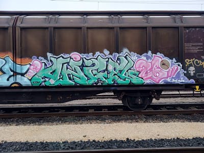 Cyan and Colorful Stylewriting by ALL CAPS COLLECTIVE, Angel and DCK. This Graffiti is located in Hungary and was created in 2020. This Graffiti can be described as Stylewriting, Trains and Freights.