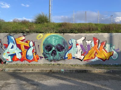 Cyan and Colorful Stylewriting by Aion and Guel. This Graffiti is located in Rio Tinto, Portugal and was created in 2022. This Graffiti can be described as Stylewriting and Characters.