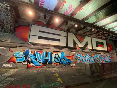 Light Blue and Red and Colorful Stylewriting by Sky High, Sorez, Nelius and smo__crew. This Graffiti is located in London, United Kingdom and was created in 2021. This Graffiti can be described as Stylewriting, Wall of Fame and Roll Up.