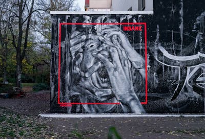 Grey and Red Characters by AIDN. This Graffiti is located in Hamburg, Germany and was created in 2020. This Graffiti can be described as Characters and Wall of Fame.