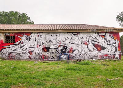 Red and Chrome Stylewriting by Wios. This Graffiti is located in Spain and was created in 2021. This Graffiti can be described as Stylewriting and Abandoned.