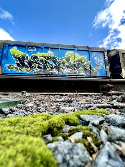 Light Blue and Grey and Light Green Trains by Pencil. This Graffiti is located in Stockholm, Sweden and was created in 2022. This Graffiti can be described as Trains, Stylewriting and Freights.
