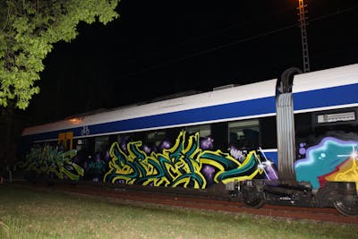 Cyan and Yellow Trains by Sbek. This Graffiti is located in Germany and was created in 2020. This Graffiti can be described as Trains and Stylewriting.