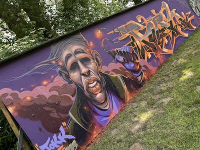 Violet and Orange Stylewriting by Tokk and Pork. This Graffiti is located in Oldenburg, Germany and was created in 2022. This Graffiti can be described as Stylewriting and Characters.