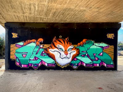 Cyan and Orange and Colorful Stylewriting by Aker and Ypso. This Graffiti is located in Barcelona, Spain and was created in 2023. This Graffiti can be described as Stylewriting, Characters and Wall of Fame.