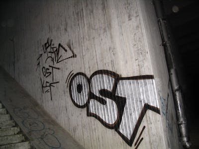 Chrome Stylewriting by urine and OST. This Graffiti is located in Brehna, Germany and was created in 2006. This Graffiti can be described as Stylewriting and Street Bombing.