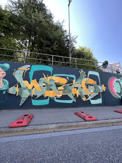 Orange and Cyan and Black Stylewriting by mobar. This Graffiti is located in Ingolstadt, Germany and was created in 2023.