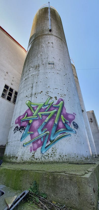 Cyan and Light Green and Violet Stylewriting by fil, urbansoldierz, graffdinamics and mtrclan. This Graffiti is located in Lleida, Spain and was created in 2023. This Graffiti can be described as Stylewriting, Atmosphere and Abandoned.