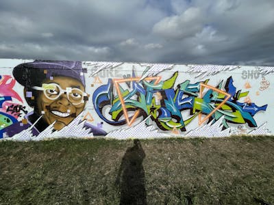 White and Colorful Stylewriting by ORES24. This Graffiti is located in HALLE, Germany and was created in 2022. This Graffiti can be described as Stylewriting, Characters and Wall of Fame.