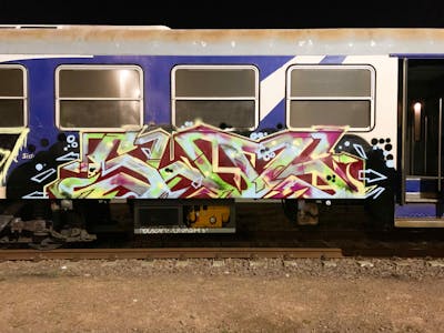 Colorful Trains by Slog175, DOS and KD. This Graffiti is located in Venice, Italy and was created in 2022. This Graffiti can be described as Trains and Stylewriting.