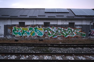 Colorful and Green and White Stylewriting by Tresk and Eros. This Graffiti is located in Odzaci, Serbia and was created in 2023. This Graffiti can be described as Stylewriting and Line Bombing.