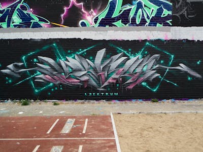 Grey and Cyan Stylewriting by Spektrum. This Graffiti is located in Rostock, Germany and was created in 2021. This Graffiti can be described as Stylewriting, Futuristic and 3D.