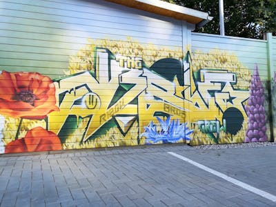 Colorful and Yellow Stylewriting by rizok, R120K, bros and NBSWE. This Graffiti is located in Leipzig, Germany and was created in 2021. This Graffiti can be described as Stylewriting, Wall of Fame and Commission.
