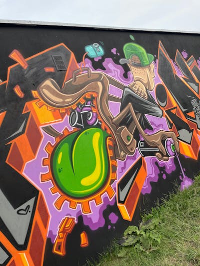 Light Green and Brown Characters by PETION. This Graffiti is located in Kluczbork, Poland and was created in 2022. This Graffiti can be described as Characters and Wall of Fame.