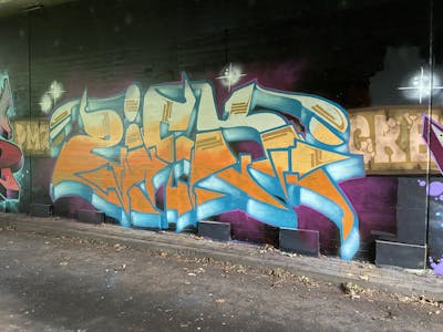 Orange and Light Blue Stylewriting by ZICK. This Graffiti is located in Wilhelmshaven, Germany and was created in 2022. This Graffiti can be described as Stylewriting and Wall of Fame.