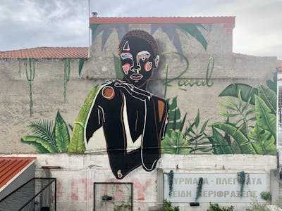 Black and Light Green Characters by Merlin. This Graffiti is located in Katerini, Greece and was created in 2022. This Graffiti can be described as Characters and Murals.