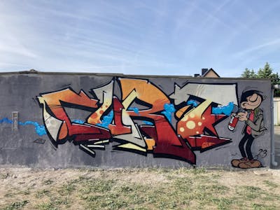 Red and Orange and Grey Stylewriting by Curt. This Graffiti is located in Dessau-Roßlau, Germany and was created in 2023. This Graffiti can be described as Stylewriting and Characters.