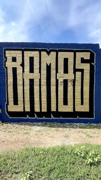 Gold and Black and Blue Stylewriting by Bamos. This Graffiti is located in Valencia, Spain and was created in 2023.