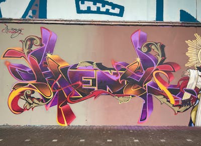 Yellow and Red and Violet Stylewriting by Heny. This Graffiti is located in Belgium and was created in 2022. This Graffiti can be described as Stylewriting and Wall of Fame.