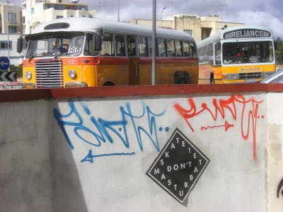 Light Blue and Red Handstyles by Riots. This Graffiti is located in Malta and was created in 2011.