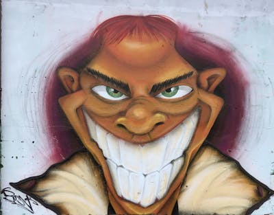 Orange and Beige Characters by Resn. This Graffiti is located in Poland and was created in 2023.