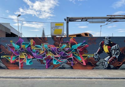 Colorful Stylewriting by Heny and Alfa crew. This Graffiti is located in Antwerp, Belgium and was created in 2022. This Graffiti can be described as Stylewriting, Characters and Wall of Fame.