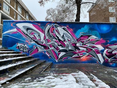 Grey and Blue and Violet Street Bombing by Chips and CDSK. This Graffiti is located in London, United Kingdom and was created in 2022. This Graffiti can be described as Street Bombing and Stylewriting.