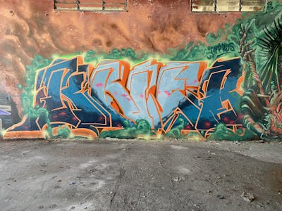 Green and Orange and Light Blue Stylewriting by Kneb1. This Graffiti is located in Limassol, Cyprus and was created in 2023. This Graffiti can be described as Stylewriting, Characters and Abandoned.