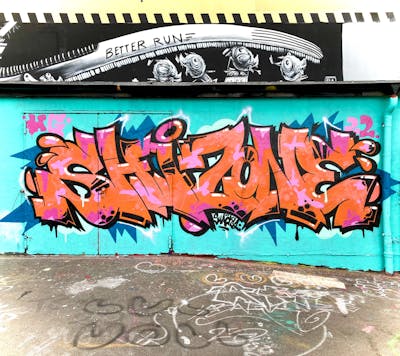 Gold and Cyan Stylewriting by Shacky and HG crew. This Graffiti is located in Leipzig, Germany and was created in 2022. This Graffiti can be described as Stylewriting and Wall of Fame.