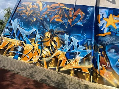 Light Blue and Blue and Orange Stylewriting by Wok. This Graffiti is located in Dresden, Germany and was created in 2023. This Graffiti can be described as Stylewriting and Characters.