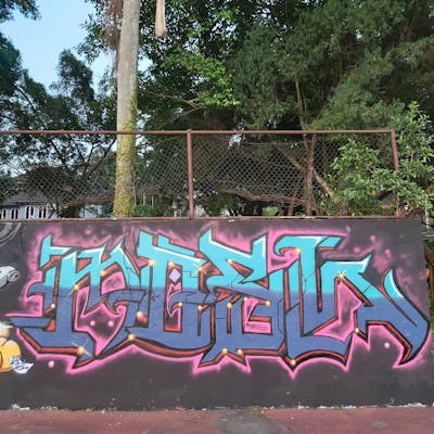 Light Blue and Violet Stylewriting by MOSH. This Graffiti is located in Kuala Lumpur, Malaysia and was created in 2021.