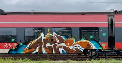 Brown and Colorful Stylewriting by Roweo. This Graffiti is located in Saalfeld (Saale), Germany and was created in 2020. This Graffiti can be described as Stylewriting and Trains.