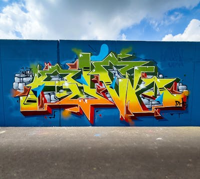 Orange and Green and Yellow Stylewriting by PUCK. This Graffiti is located in Antwerpen, Belgium and was created in 2024. This Graffiti can be described as Stylewriting and Wall of Fame.
