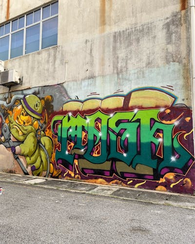 Light Green and Colorful Characters by MOSH. This Graffiti is located in Kuala Lumpur, Malaysia and was created in 2021. This Graffiti can be described as Characters and Stylewriting.