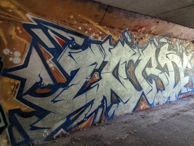Chrome and Blue and Brown Stylewriting by LORD. This Graffiti is located in Caen, France and was created in 2023.