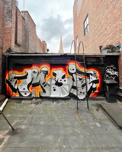 Chrome and Orange and Black Stylewriting by MOI. This Graffiti is located in NEW YORK CITY, United States and was created in 2023.