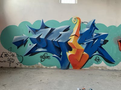 Blue and Orange and Cyan Stylewriting by Czosen1. This Graffiti is located in Warsaw, Poland and was created in 2023. This Graffiti can be described as Stylewriting, Abandoned and 3D.