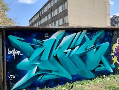 Cyan and Blue Stylewriting by Czosen1. This Graffiti is located in Grodzisk Mazowiecki, Poland and was created in 2022. This Graffiti can be described as Stylewriting, 3D and Wall of Fame.