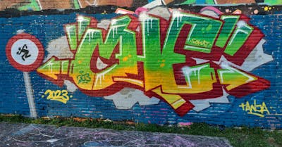 Light Green and Yellow and Red Stylewriting by CHE. This Graffiti is located in Sittard, Netherlands and was created in 2023. This Graffiti can be described as Stylewriting and Wall of Fame.