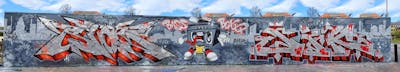Chrome and Grey and Red Stylewriting by Riots and jik. This Graffiti is located in Leipzig, Germany and was created in 2023. This Graffiti can be described as Stylewriting, Characters and Wall of Fame.