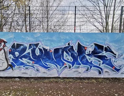 Blue and Light Blue and White Stylewriting by Ruok. This Graffiti is located in Dresden, Germany and was created in 2022. This Graffiti can be described as Stylewriting and Wall of Fame.